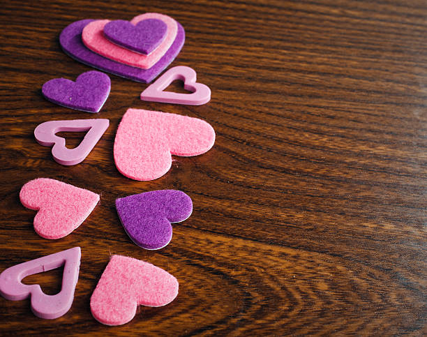 istock red and pink hearts on a wooden background 512552678