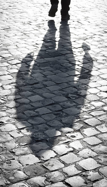 istock Roman cobblestone leg silhouette, Rome Italy 512553898