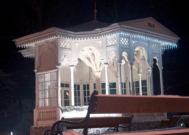 Photo of Art Nouveau spa pavilion at night in winter HDR