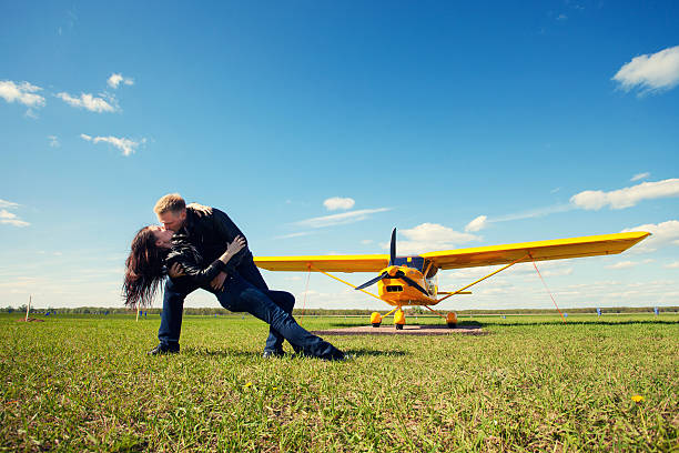 istock lovers against the plane outdoors 512568090