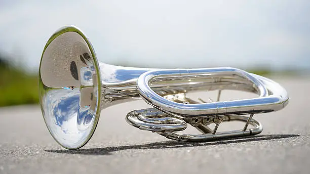 Close up of a detached silver marching baritone.