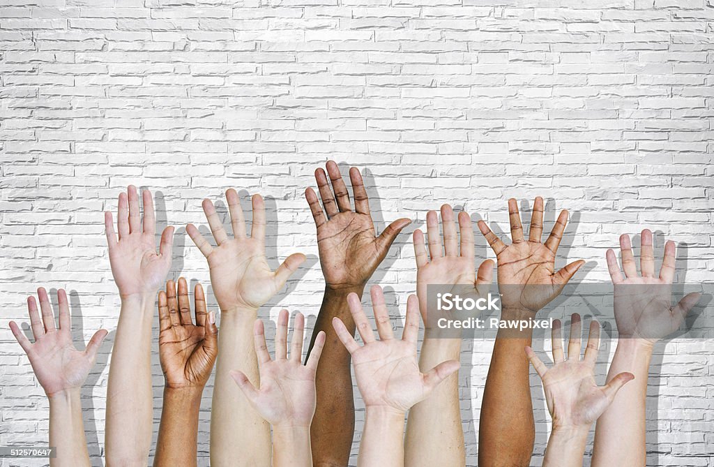 Hand Raised on Brick Wall Freedom Stock Photo