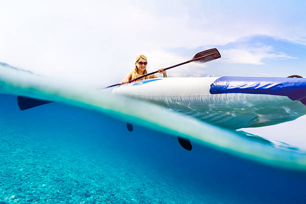 Sea kayaking with underwater and seabed visible