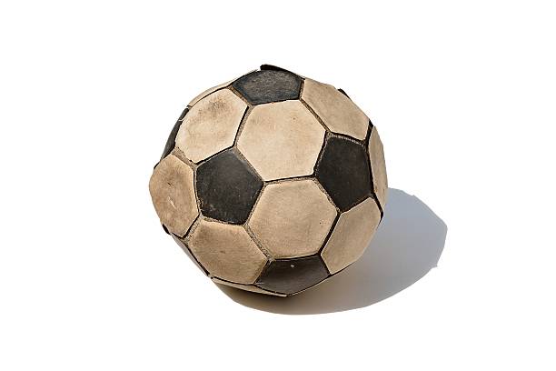 istock Dirty soccer ball isolated on white background 512570824