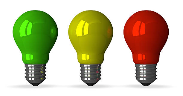 istock Green, yellow and red tungsten light bulbs, front view 512571303