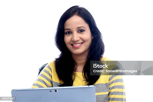 Young Woman Working With Tablet Computer Stock Photo - Download Image Now - Adult, Asian and Indian Ethnicities, Brown Hair