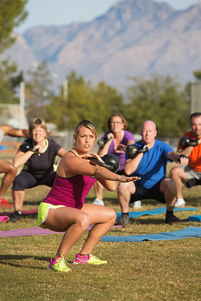 istock Adults Exercising Near Mountains 512571755
