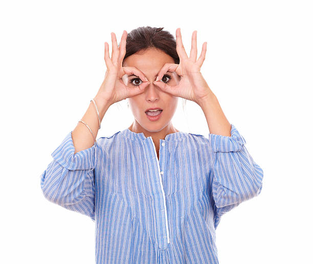 istock Charismatic latin female with binoculars hands 512571795