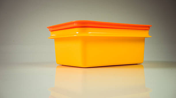 istock Retro styled food carrier or retro color plastic lunch box 512572594