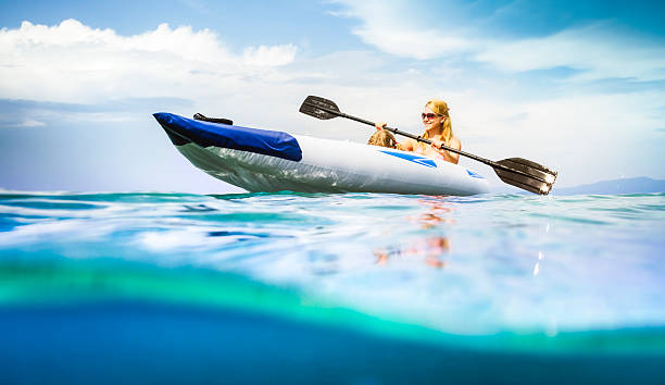 istock Family kayaking on sea, water level view 512572991