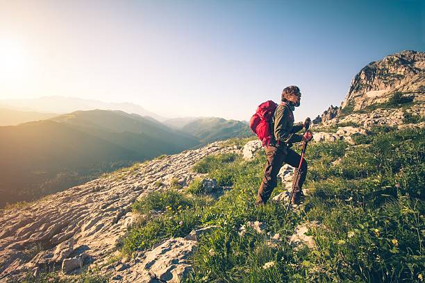istock Young Man with backpack mountaineering outdoor 512573006