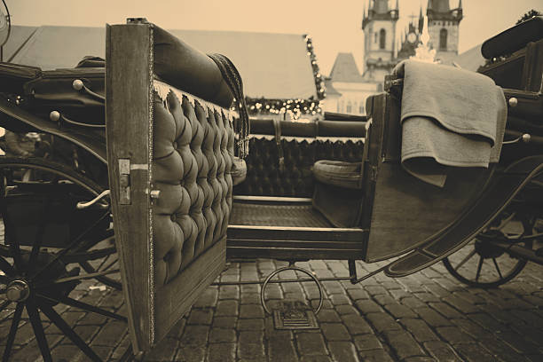 istock Beautiful old carriage with opened doors in Prague,  retro colors 512573075