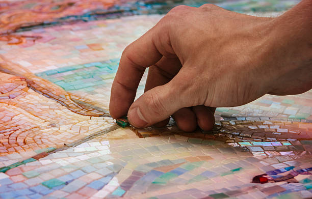 Man making mosaic stock photo