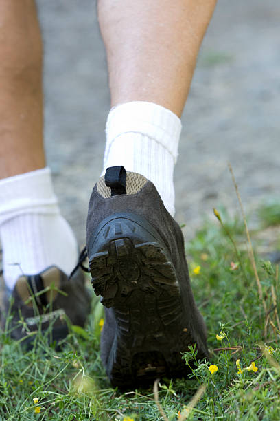 istock close-up of man's feet walking away 512573185