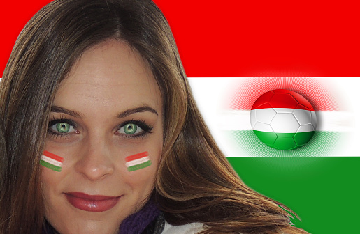 Beautiful Hungarian girl with the flag painted on her face