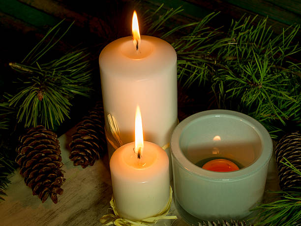 istock Candles with fir cones and pine branches. 512574366