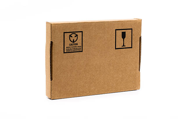 istock Cardboard box in hand isolated on white 512574467