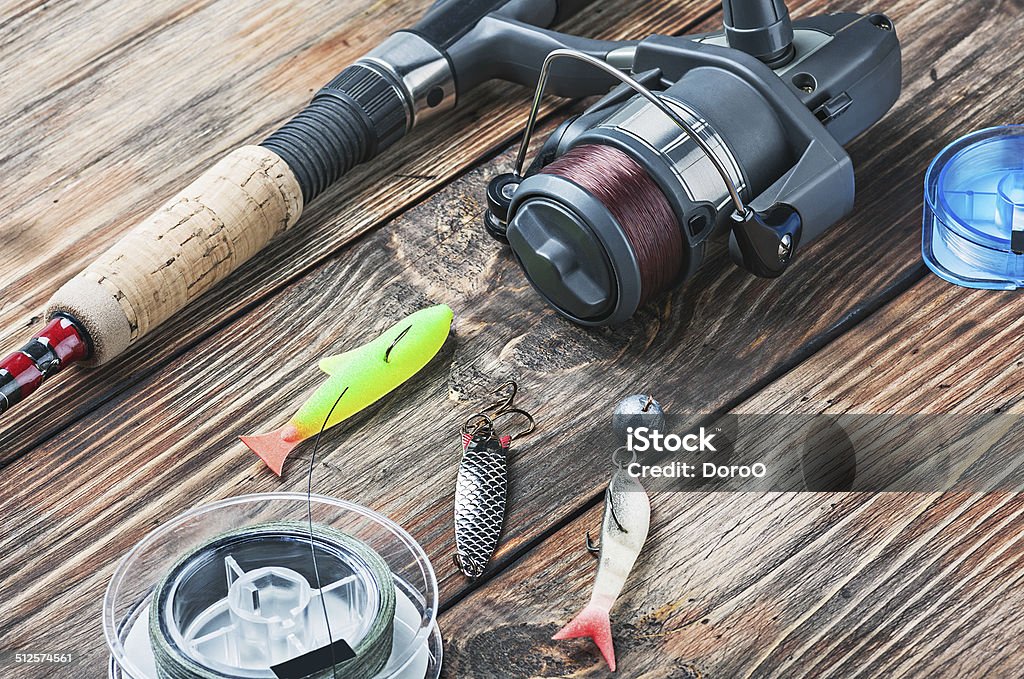 fishing tackle fishing tackle on a wooden table Fishing Industry Stock Photo