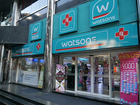 Bangkok, Thailand-January 29, 2016: View of Watsons shop from the sidewalk in Bangkok. Watson is retail shop selling health and beauty goods. There are people walking past the shop.