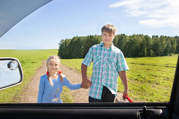 istock cute girl and boy with suitcase 512576951