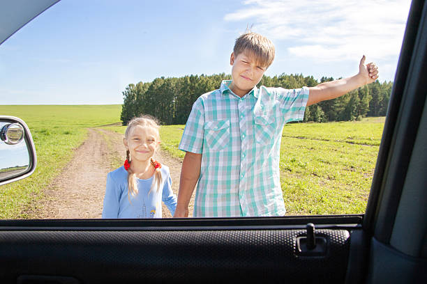 istock cute girl and boy with suitcase 512577553
