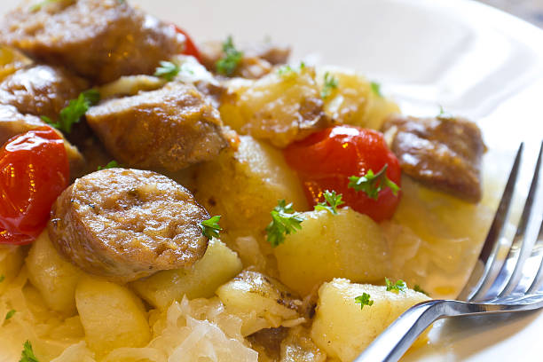 Chopped sausage with potatoes and sauerkraut ready to be eaten
