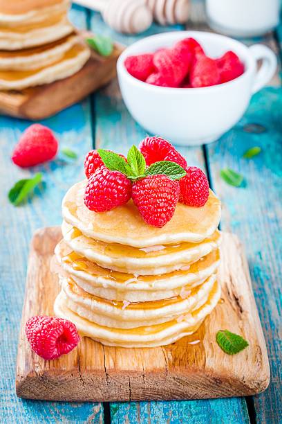 istock Homemade pancakes with honey and raspberry 512591330