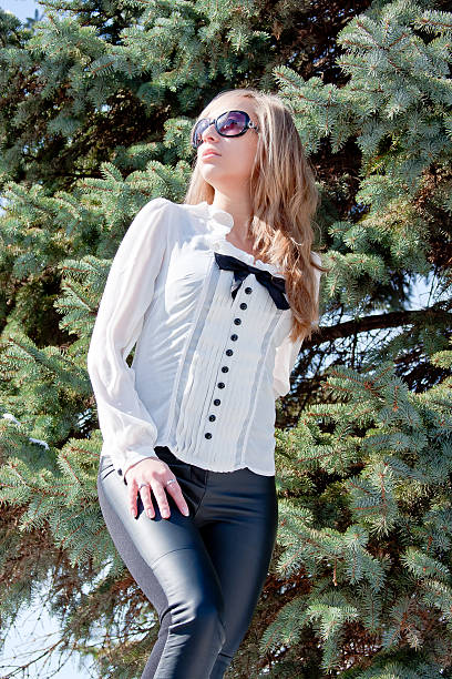 istock young woman in a winter park 512591988