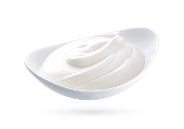 istock sour cream in bowl isolated on white background 512592444