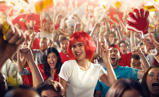 istock Sport fans: A girl show victory sign 512592534