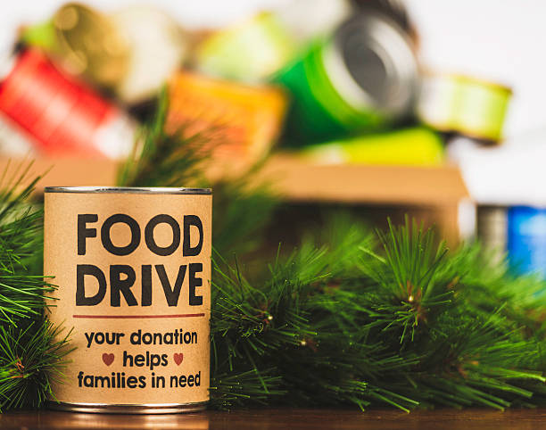 пожалуйста, поддержку наших продуктов drive. holiday консервы drive - food canned food drive motivation стоковые фото и изображения