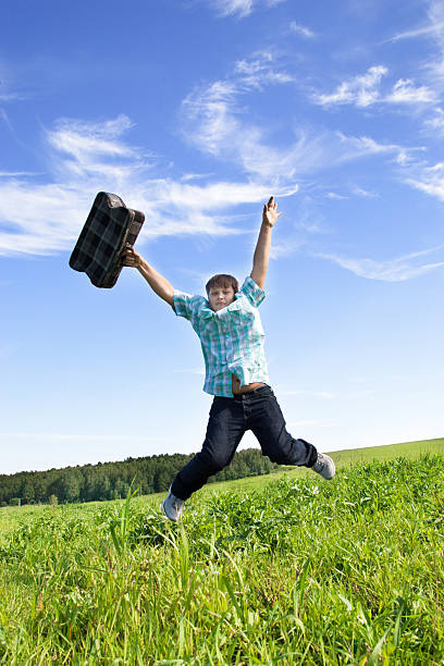 istock Boy jumping on a green meadow 512599061