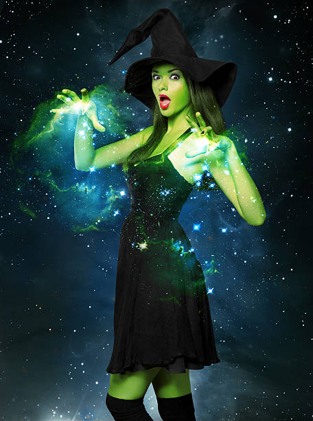 istock Beautiful young woman as halloween witch 512599517