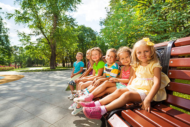 istock Boys and girls rest in park 512600285