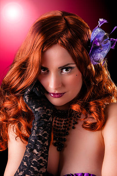 Beautiful young burlesque showgirl with piercing eyes stock photo