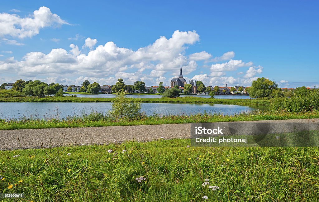 Skyline of an ancient city along a river Bicycle Lane Stock Photo