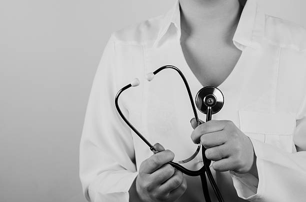 istock woman doctor holding stethoscope 512601621