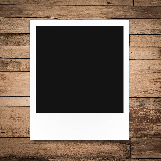 istock photo frame on brown wood plank background 512604153