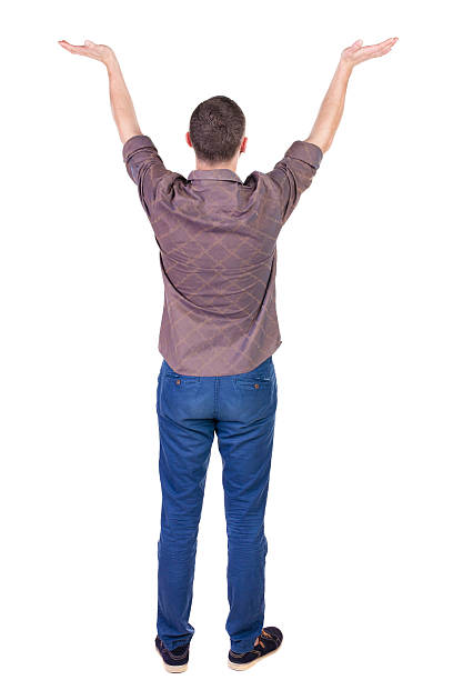 istock Back view of Beautiful man in jeans looking at wall 512604583