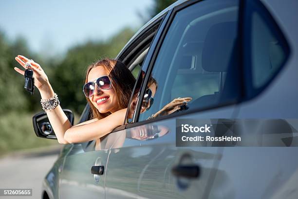 Car Driver Woman Happy Showing Keys Out Window Stock Photo - Download Image Now - Car Key, Car, Teenage Girls