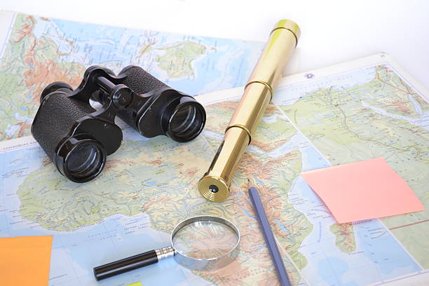 map of Africa with magnifying glass, spyglass, binoculars, pencil