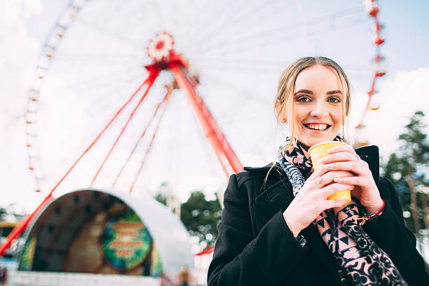 istock Girl has morning coffee in a park 512617732