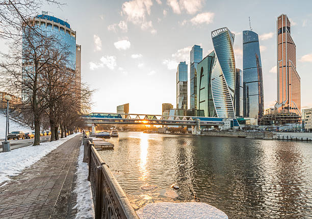 istock Pedestrian bridge Bagration in the winter at sunset. 512618396