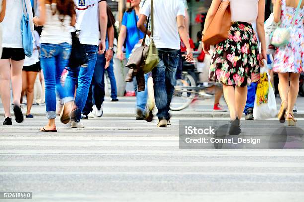 Motion Blurred Pedestrians Crossing Sunlit Street Stock Photo - Download Image Now - People, Street, Crowd of People