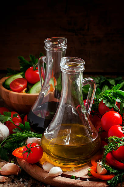 istock Fresh olive oil in glass carafe with tomatoes 512619406