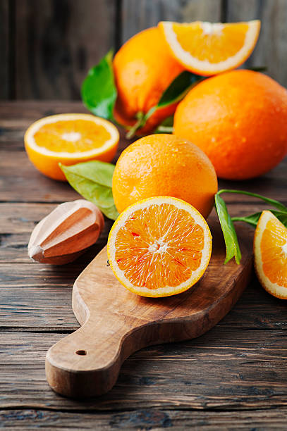 istock Fresh sweet oranges on the wooden table 512620066