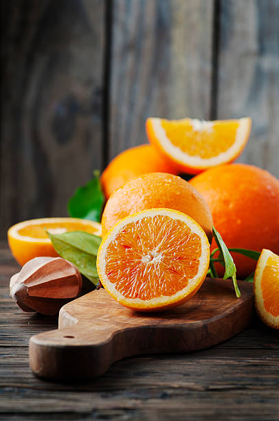 istock Fresh sweet oranges on the wooden table 512620422