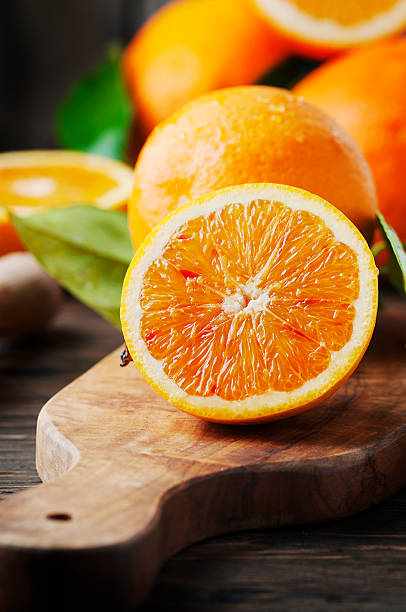 istock Fresh sweet oranges on the wooden table 512620466