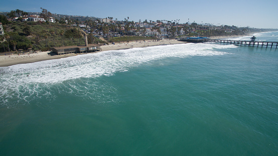 High angle view of San Clemente coastline and pier in Southern California.
