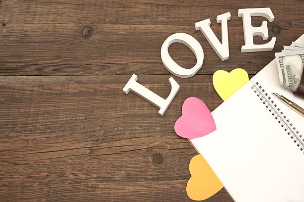 Blank Spiral Notepad Page, Hearts, Wallet On Wood Table Backgro Blank And Empty Spiral Notepad Or Notebook Page, Pink Paper Hearts, Make Wallet On Rough Wood Table Background menage trois stock pictures, royalty-free photos & images